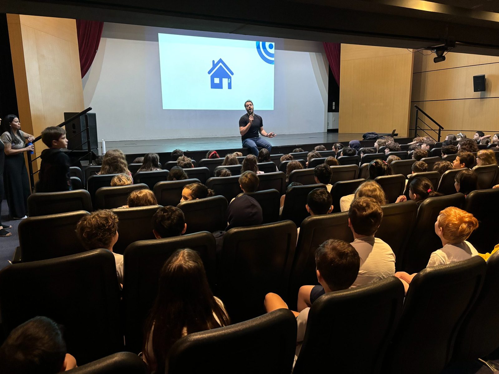 A Body & Mind session with students in an auditorium